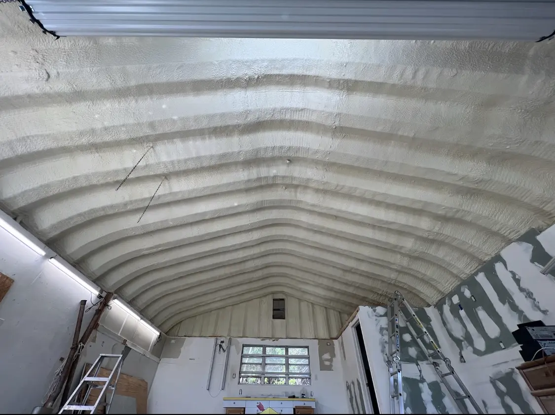 Spray polyurethane foam applied to the underside of a metal roof deck in Long Grove